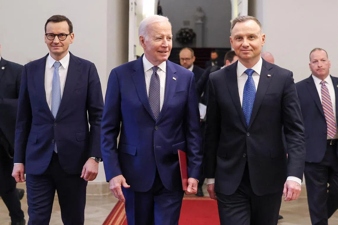 U.S. President Joe Biden and Polish President Andrzej Duda and Prime Minister Mateusz Morawiecki walk during a bilateral meeting to discuss collective efforts to support Ukraine and bolster NATO's deterrence at the Presidential Palace in Warsaw, Poland, February 21, 2023. Jakub Szymczuk/KPRP​/Handout via REUTERS ATTENTION EDITORS - THIS IMAGE HAS BEEN SUPPLIED BY A THIRD PARTY. NO RESALES. NO ARCHIVES