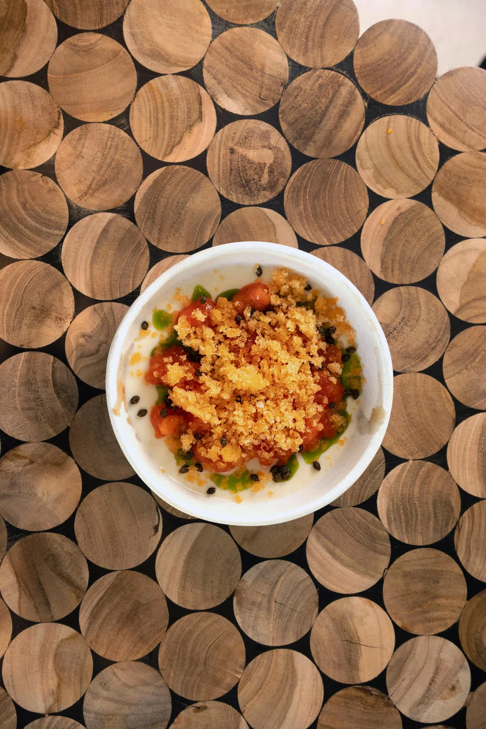 Papaya panna cotta, papaya skin granite and crunchy papaya seeds make this dessert one of the highlights.