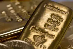 Lower interest rates reduce the opportunity cost of holding the non-yielding bullion.