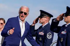 US President Joe Biden gestures as he boards Air Force One at Harrisburg International Airport en route to Washington, following a campaign event in Harrisburg, Pennsylvania, July 7, 2024. 