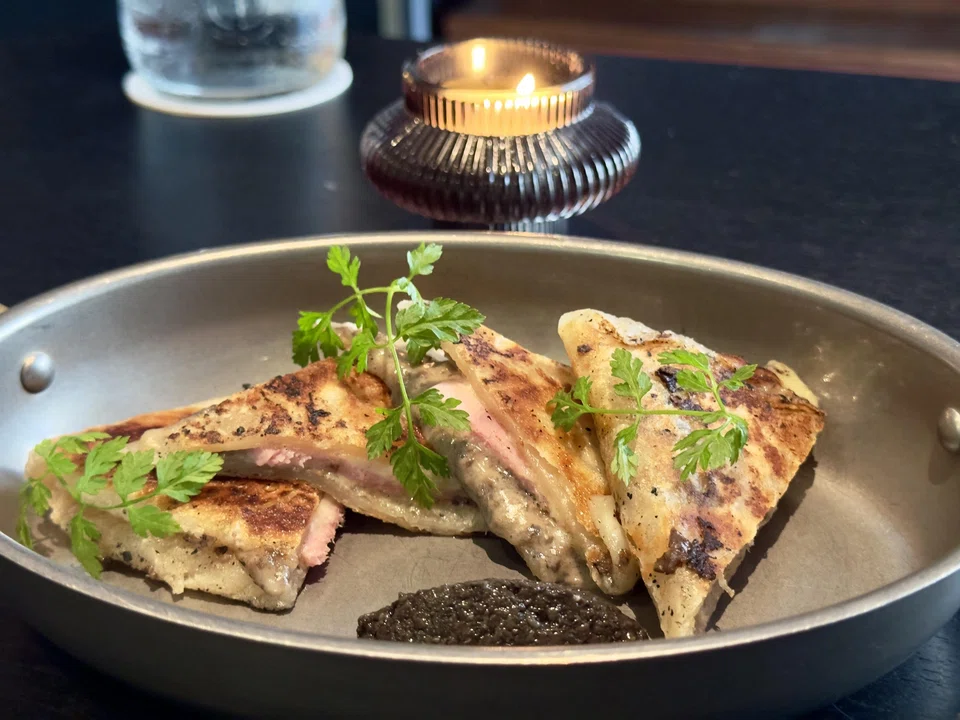 Croque prata features the Indian bread stuffed with ham and truffle bechamel.