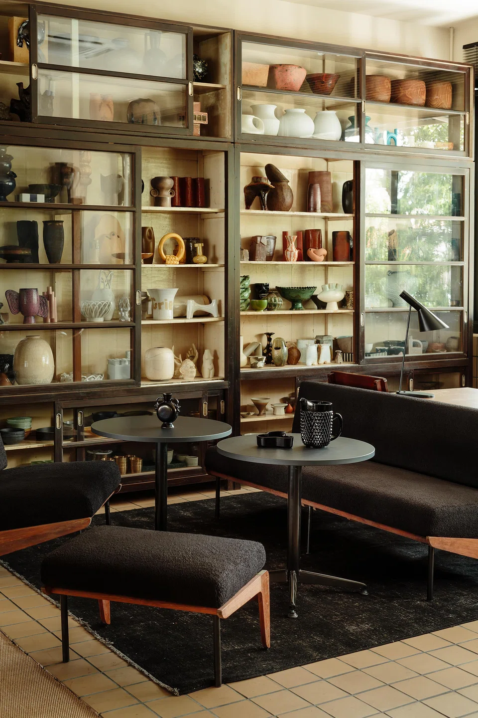 Shelves are filled with a range of vessels for botanical arrangements.