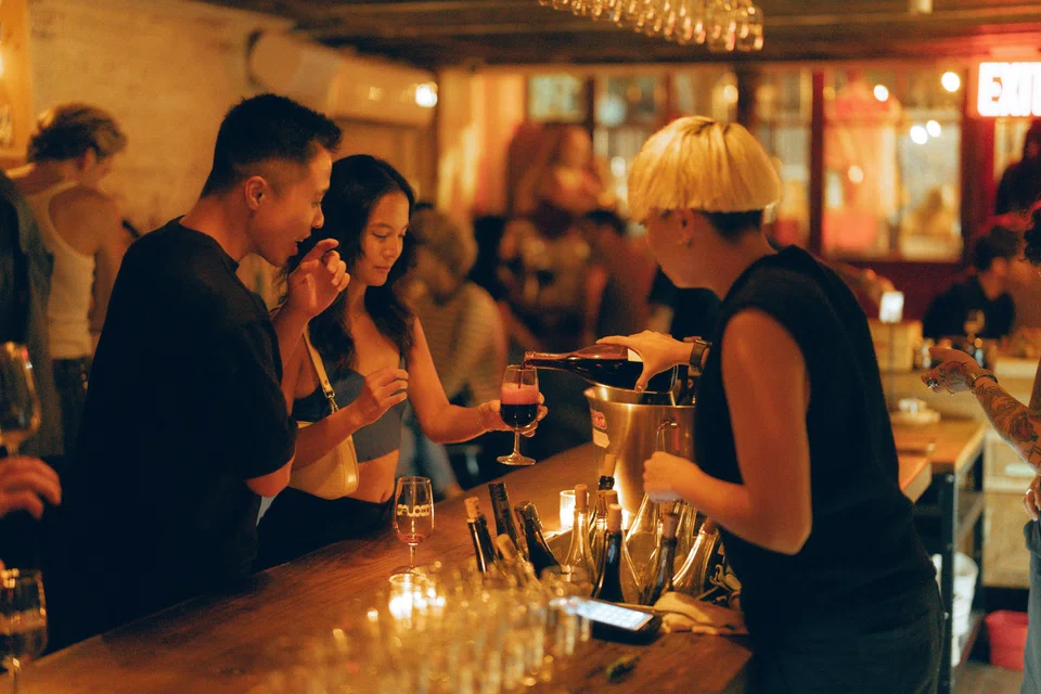 Patrons at Sauced, a wine bar in the Williamsburg neighbourhood of Brooklyn, Sep 6. Some Gen Z-ers and young millennials say the culture and aesthetics of wine meld with their lifestyles, whether they're drinking or not. 