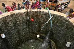 Villagers fill water from a well in Shahapur, Maharashtra, amid an ongoing heatwave, May 26, 2024. Far from India's financial capital Mumbai, impoverished villages in areas supplying the megacity's water are running dry - a crisis repeated across the country that experts say foreshadows terrifying problems. Demand is increasing in the world's most populous nation of 1.4 billion people, but supplies are shrinking - with climate change driving erratic rainfall and extreme heat. 
