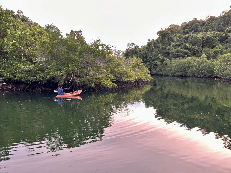 A lone fisherman sails into the sunset at Ao Salat fishing village.