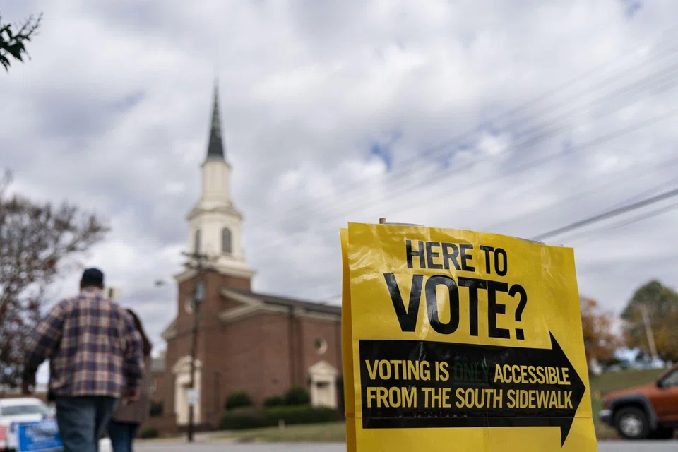 A sign to vote in North Carolina, US. The most recent New York Times/Siena College poll shows the 2024 presidential race in a dead heat, but only time will tell how accurate it is. 