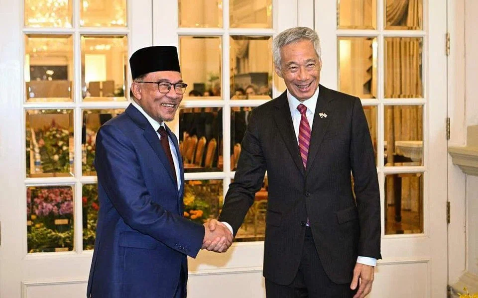 Singapore Prime Minister Lee Hsien Loong (right) says he and Malaysian Prime Minister Anwar Ibrahim had a fruitful discussion, including on how to make progress on “outstanding bilateral issues”. 