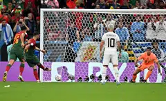 Bruno Fernandes of Portugal scores a penalty during the World Cup match between Portugal and Uruguay in Lusail, Qatar, Nov 28, 2022. 