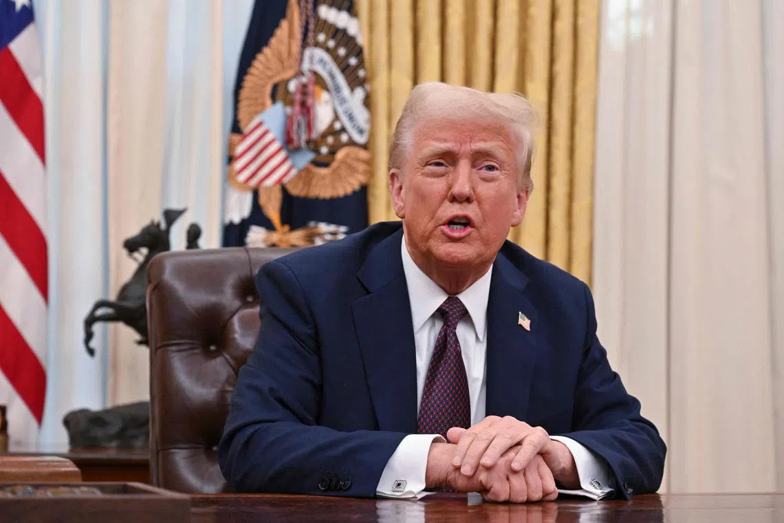 US President Donald Trump speaks to the media after signing Executive Orders in the Oval Office of the White House in Washington, DC, on January 23, 2025. (Photo by ROBERTO SCHMIDT / AFP)