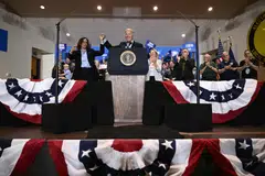 US President Joe Biden holds up US Vice-President and Democratic presidential candidate Kamala Harris's hand during a campaign rally at the International Brotherhood of Electrical Workers Local 5 in Pittsburgh, Pennsylvania, Sept 2, 2024. 