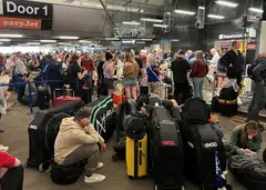 Passengers queueing outside Terminal 1 at Manchester Airport after an issue with the power supply affected the airport and a number of other buildings.