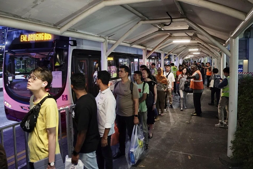 Passengers queueing for bridging bus services near Buona Vista MRT station at 7.30 pm on Sep 26. 