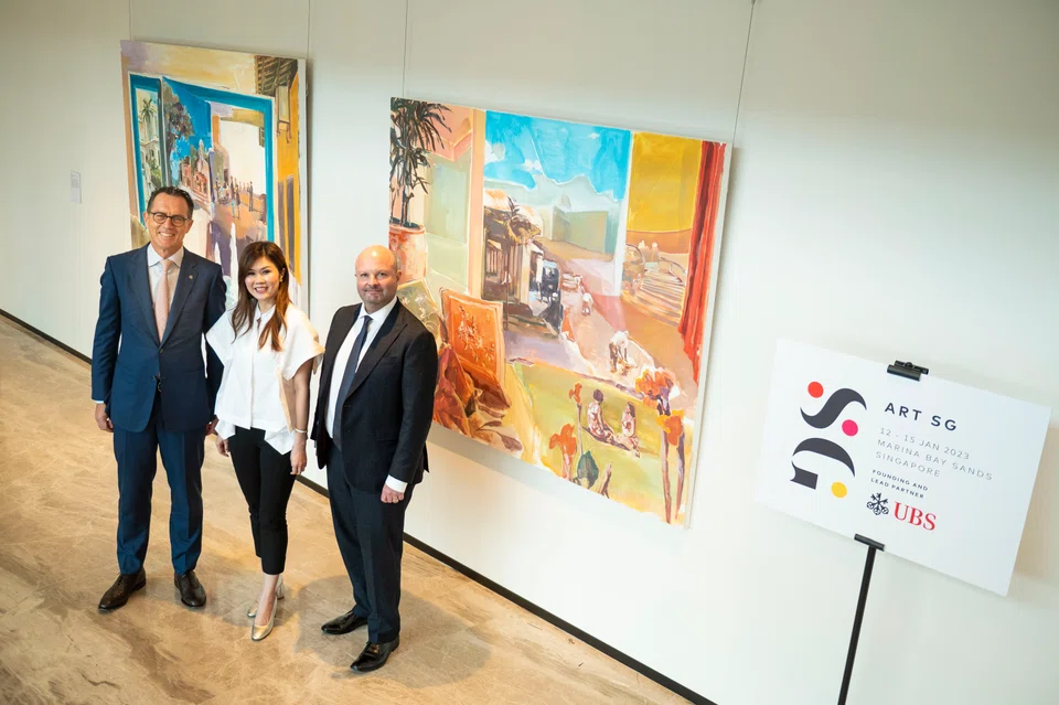 (From left) August Hatecke, co-head Global Wealth Management Asia Pacific and country head UBS Singapore; Art SG fair director Shuyin Yang and Art SG co-founder Magnus Renfrew pose before a UBS-commissioned painting by Hilmi Johandi.