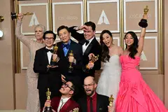 The cast and crew of "Everything Everywhere All at Once" Michelle Yeoh (second right), Ke Huy Quan (second left), Stephanie Hsu (right), Jamie Lee Curtis (left), James Hong (third left), Daniel Kwan (bottom left), Daniel Scheinert (bottom right), Jonathan Wang (centre) pose with their Oscar trophies at the 95th Annual Academy Awards in Hollywood, California, March 12, 2023. 