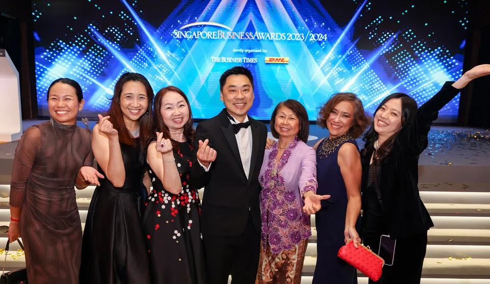 Team BT celebrating with Charles Wong, the new Businessman of the Year.