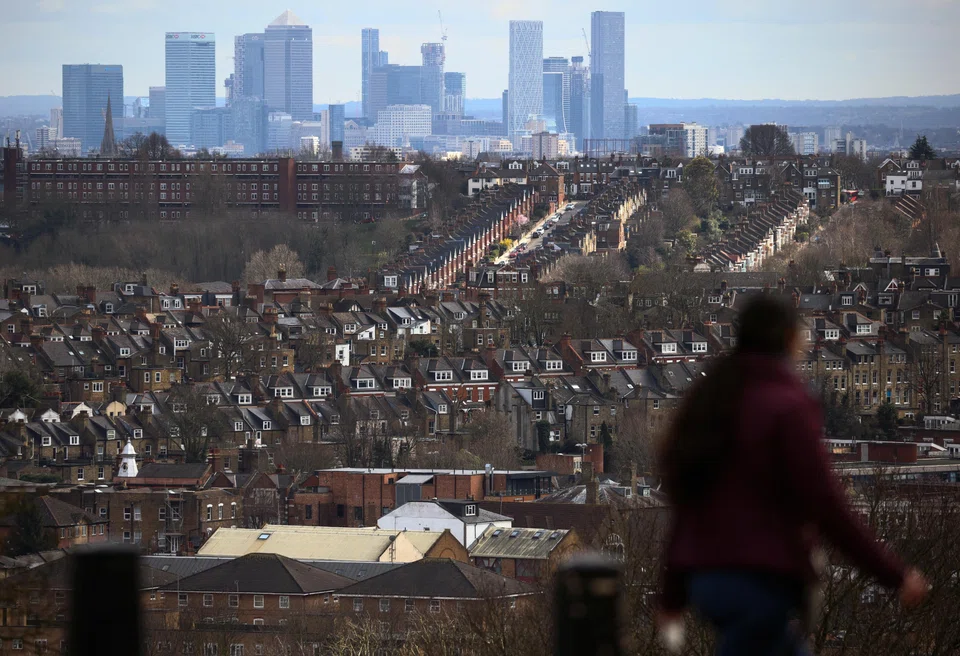 Rows of houses in front of the Canary Wharf skyline in London. The UK has concluded negotiations to join the 11-member Comprehensive and Progressive Agreement for Trans-Pacific Partnership.