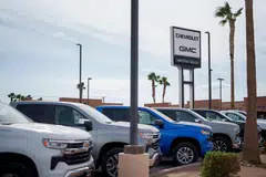 New vehicles for sale at a Chevrolet GMC dealership in California. Trump's tariffs are likely to increase the costs of the many foreign components that go into American cars, and raise prices for US automakers and consumers.