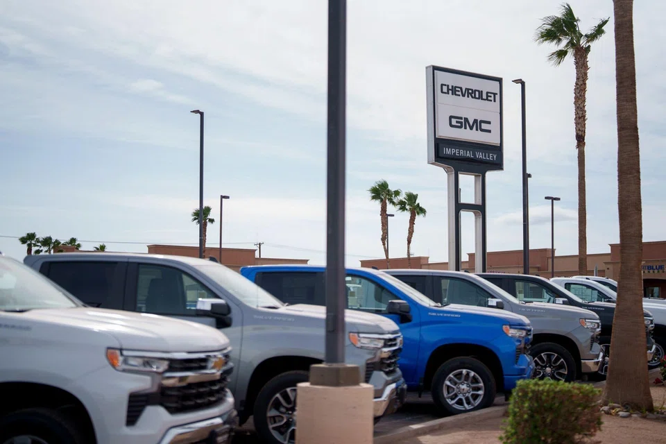 New vehicles for sale at a Chevrolet GMC dealership in California. Trump's tariffs are likely to increase the costs of the many foreign components that go into American cars, and raise prices for US automakers and consumers.