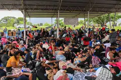 Hundreds of migrants, mostly from Venezuela and Central America, rest during their journey to the United States on foot, Chiapas, Mexico, July 24, 2024. Polls show an increasing number of Latinos are switching allegiance - a trend that poses an enormous challenge for Vice-President Kamala Harris in the 100 days she has left to counter the lure of Donald Trump and his hardline border policies.
