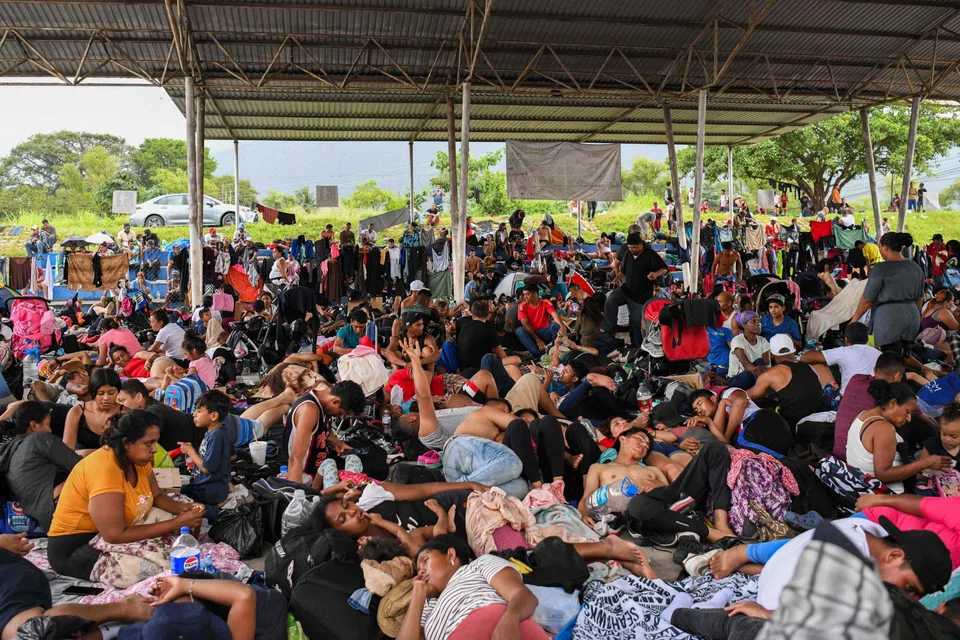 Hundreds of migrants, mostly from Venezuela and Central America, rest during their journey to the United States on foot, Chiapas, Mexico, July 24, 2024. Polls show an increasing number of Latinos are switching allegiance - a trend that poses an enormous challenge for Vice-President Kamala Harris in the 100 days she has left to counter the lure of Donald Trump and his hardline border policies.