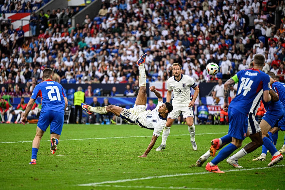 England's Jude Bellingham scores an overhead goal to equalise 1-1 against Slovakia in Gelsenkirchen, Germany, June 30, 2024. 