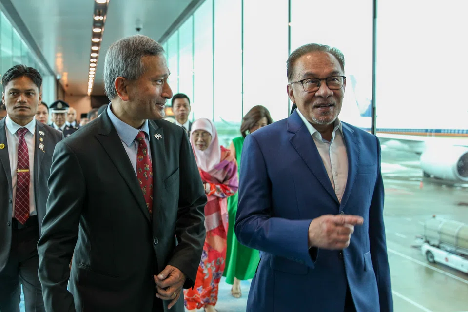 Minister for Foreign Affairs Vivian Balakrishnan (left) receiving Malaysian Prime Minister Anwar Ibrahim at Changi Airport on Monday (Jan 30) morning.