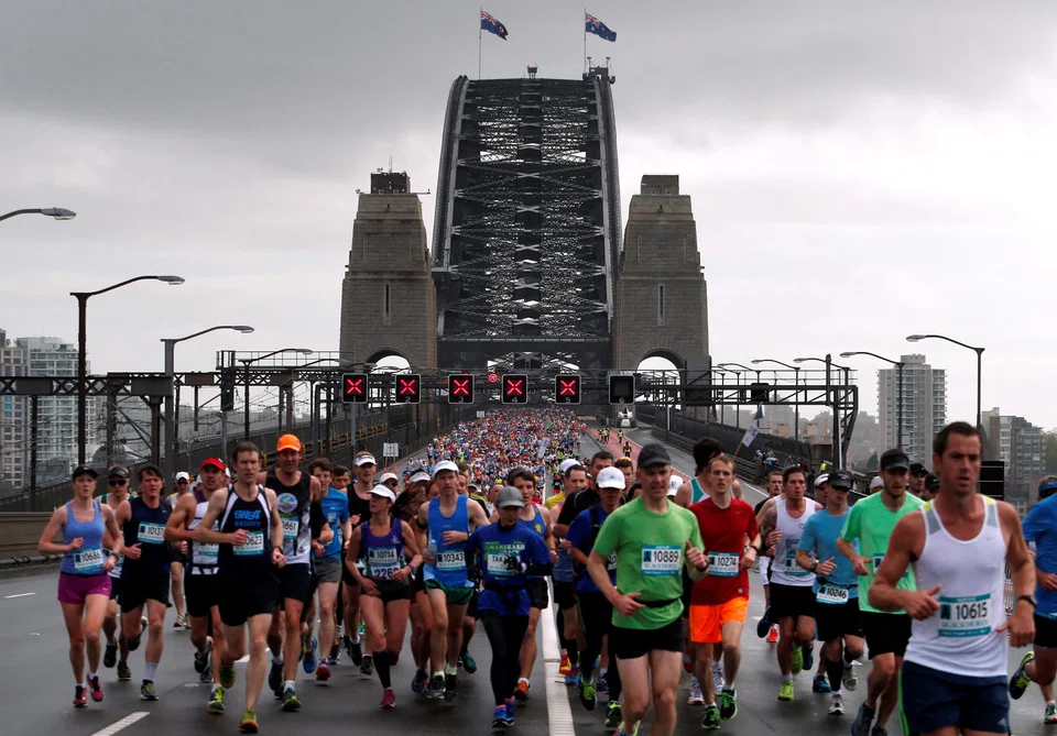 Competitors run across the Sydney Harbour Bridge during the Sydney marathon on Sep 21, 2014.  Some 25,000 runners will test themselves over a newly re-jigged course on Sunday.