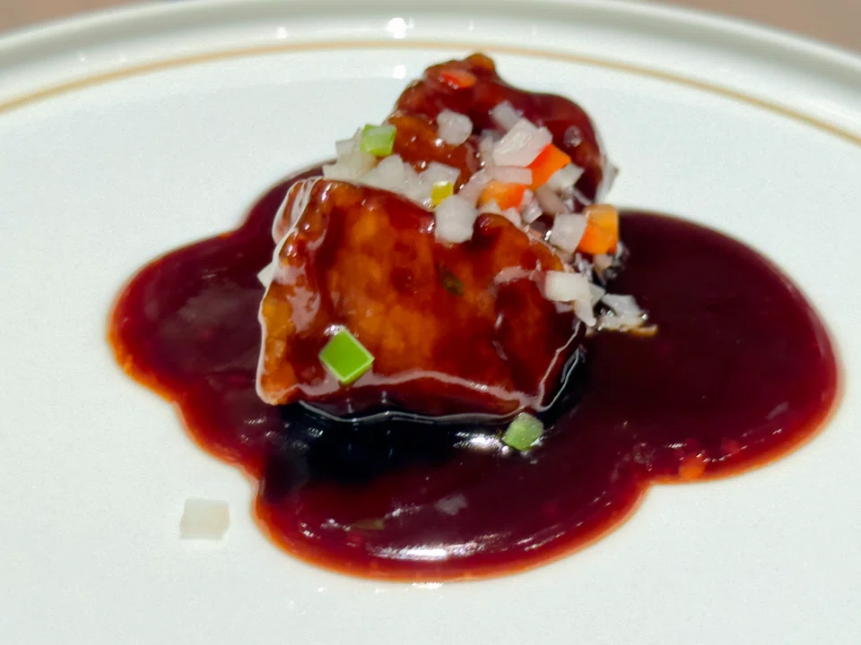 Sweet sour pork in black vinegar sauce.