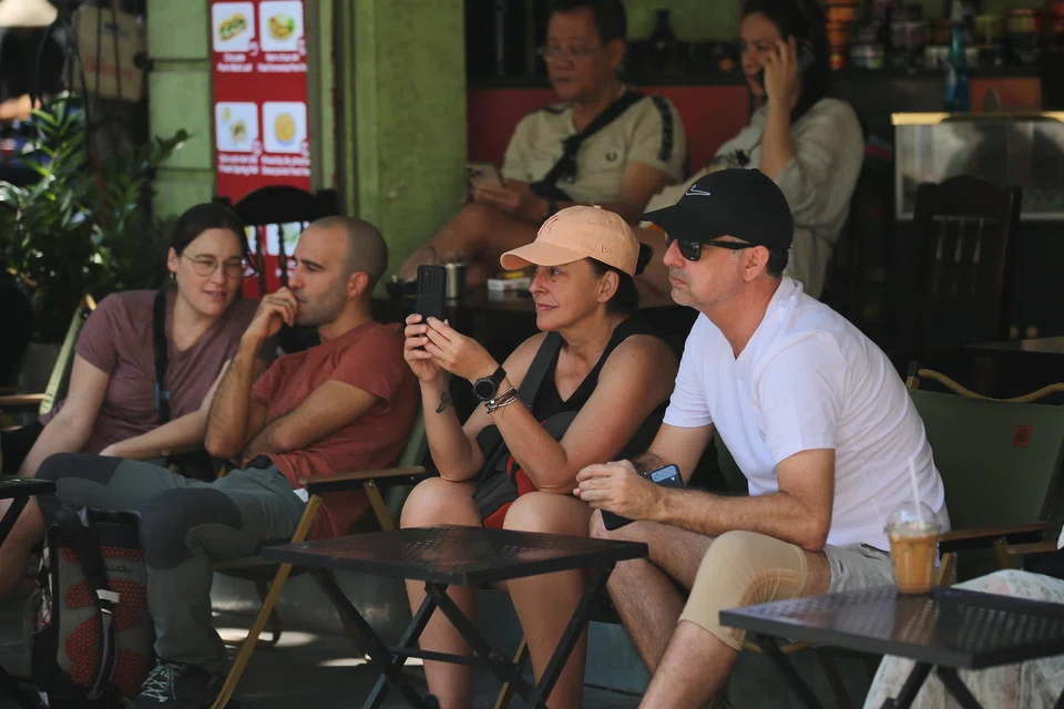 Tourists at a cafe in Hanoi. Vietnam, famous for its array of cheap and delicious food, is fast becoming a premium dining destination.