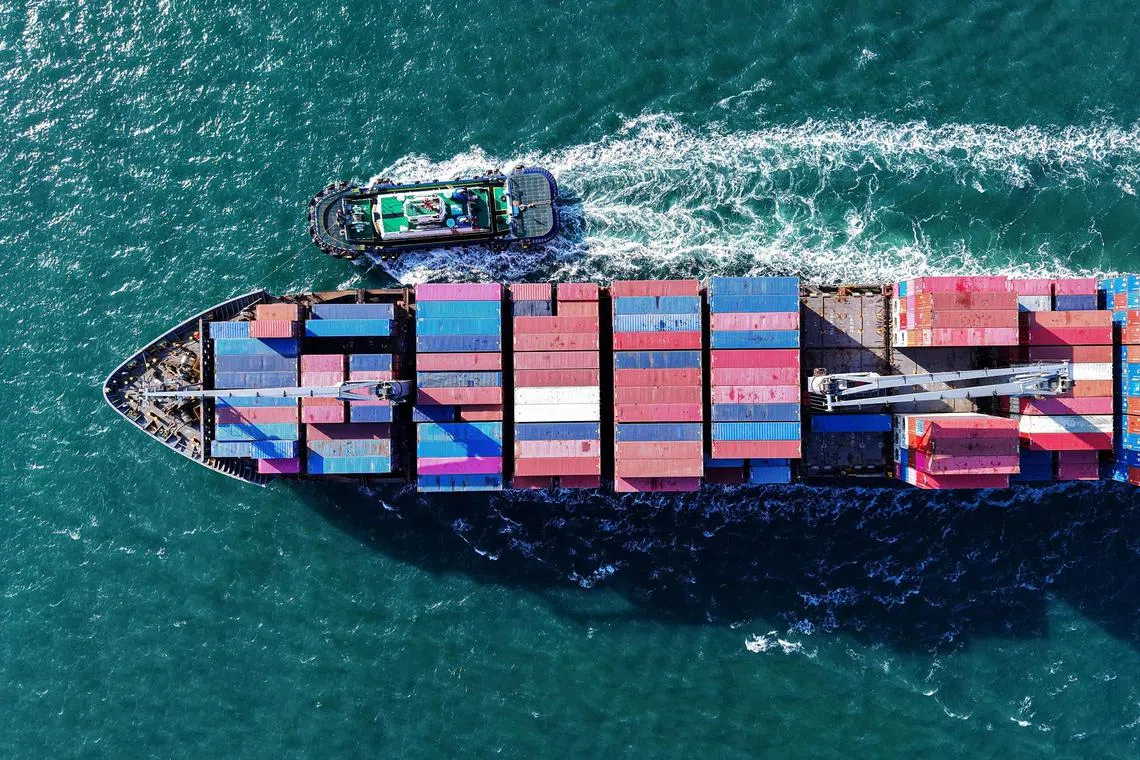 A container ship approaching a port in Qingdao, China; tariffs on China are unsurprising but what came as a shock was the tariffs on smaller Asean countries.
