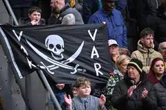 Wolves fans display a flag with an anti-VAR message in the crowd ahead of the English Premier League football match between Wolverhampton Wanderers and Luton Town at the Molineux stadium in Wolverhampton, Britain on April 27, 2024. 
