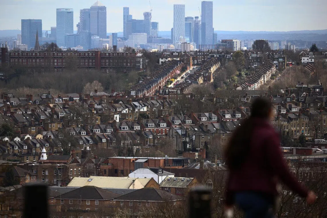 Rows of houses in front of the Canary Wharf skyline in London. The UK has concluded negotiations to join the 11-member Comprehensive and Progressive Agreement for Trans-Pacific Partnership.