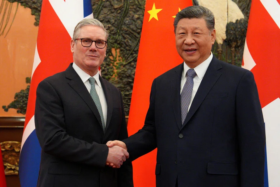 (From left) Britain's Prime Minister Keir Starmer shakes hands with Chinese President Xi Jinping ahead of a bilateral meeting in Beijing, China, Jan 29, 2026. 