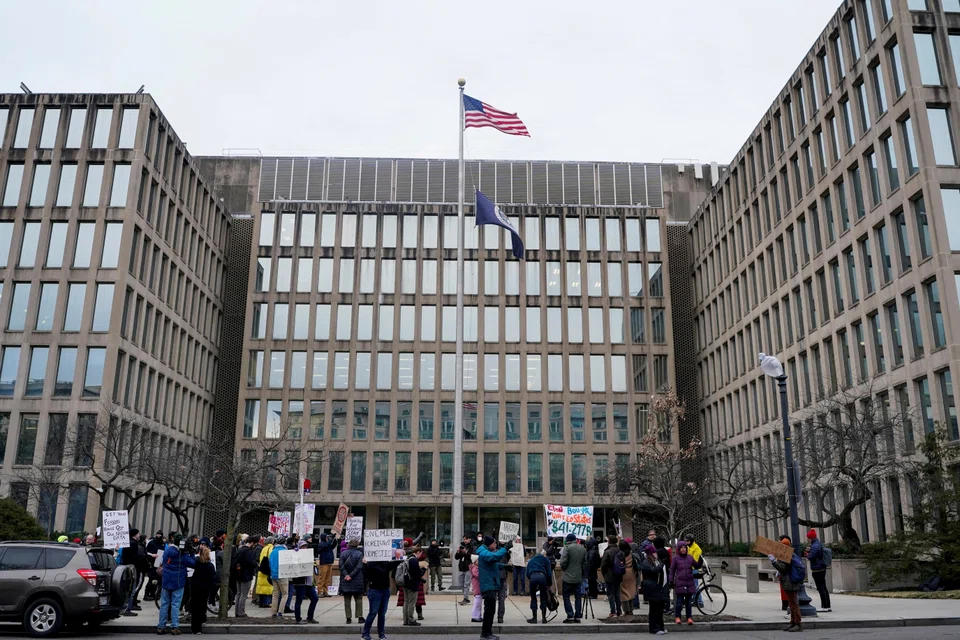 Demonstrators rally during a protest against billionaire Elon Musk, who is heading US President Donald Trump's drive to shrink the federal government, outside the US Office of Personnel Management (OPM) in Washington.