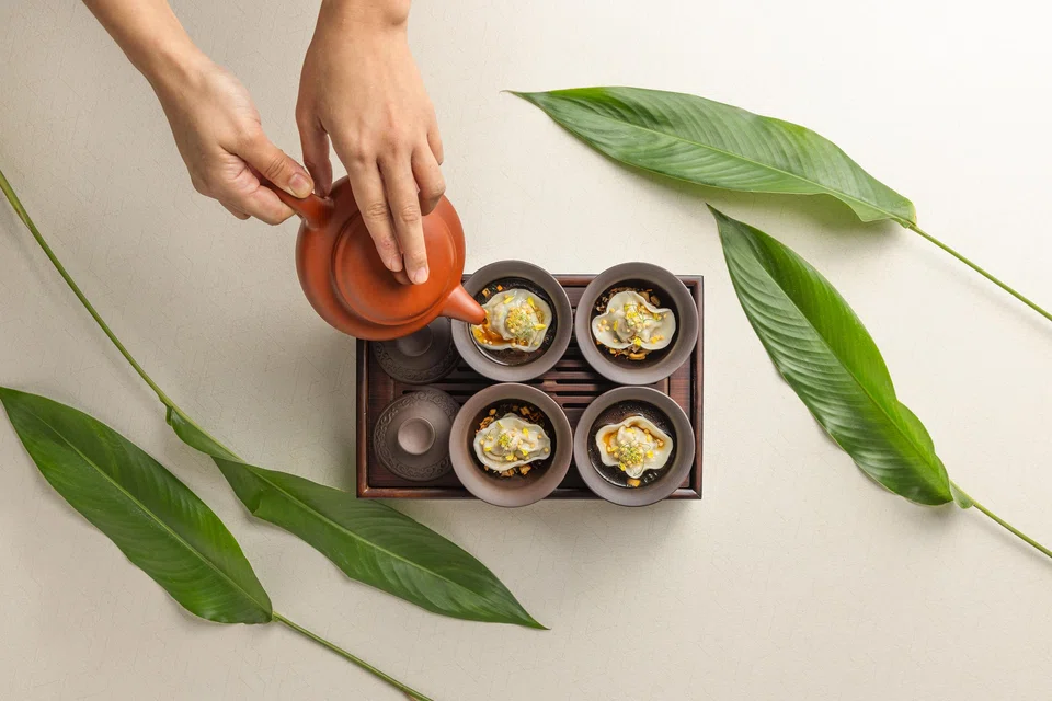 Chinese terracotta tea features piping hot mushroom broth and bouncy shrimp dumpling.