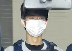 Ryuji Kimura, 24, who's suspected of throwing a smoke bomb at Japan's Prime Minister Fumio Kishida, is seen inside a police van as he is taken to prosecutors' office, Wakayama, Japan, April 17, 2023.