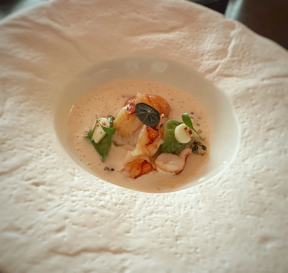 Creamy potato soup is filled with lobster pieces and smoky sweet corn niblets.