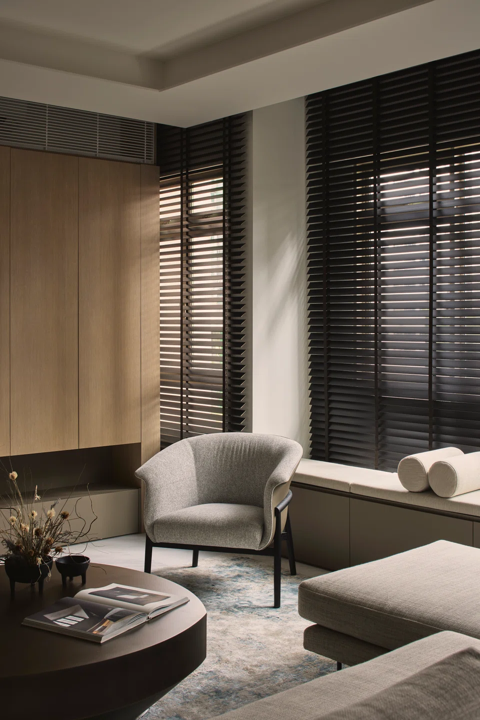 Window blinds let in filtered, soft light. 