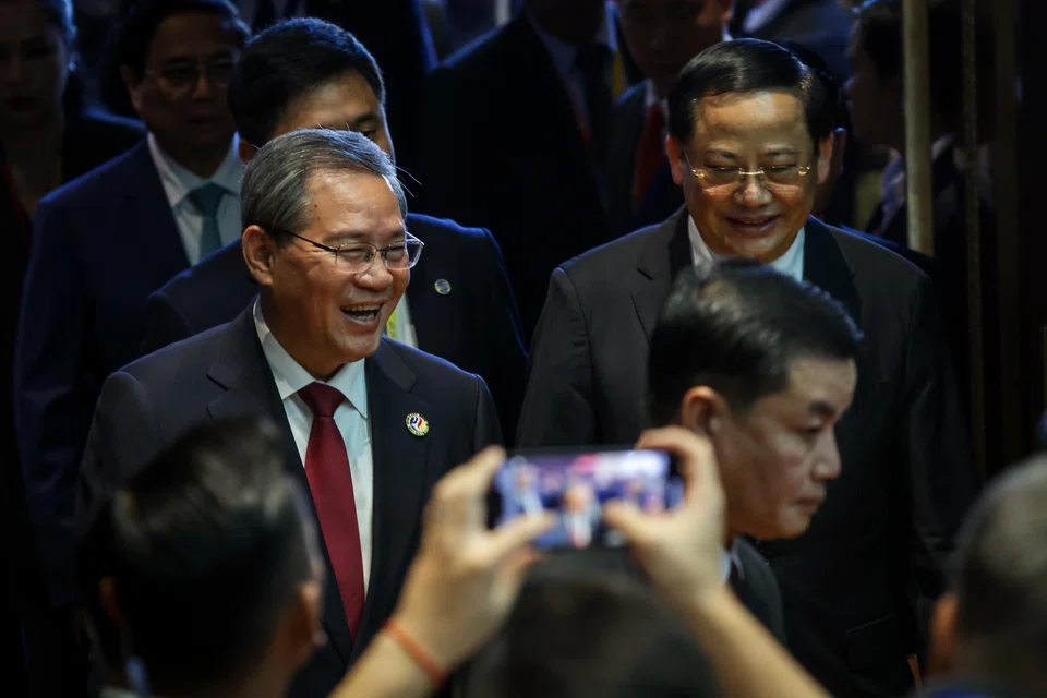 Chinese Premier Li Qiang (left) and Lao Prime Minister Sonexay Siphandone at the 27th Asean-China Summit in Laos on Oct 10, 2024.