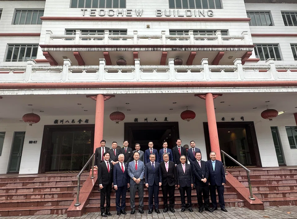 Members of the negotiation teams from Ngee Ann Kongsi and Teochew Poit Ip Huay Kuan with Edwin Tong, Minister for Culture, Community and Youth (front row, fourth from left). The two Teochew groups credit the minister for his advice and for leading the talks between the two sides.