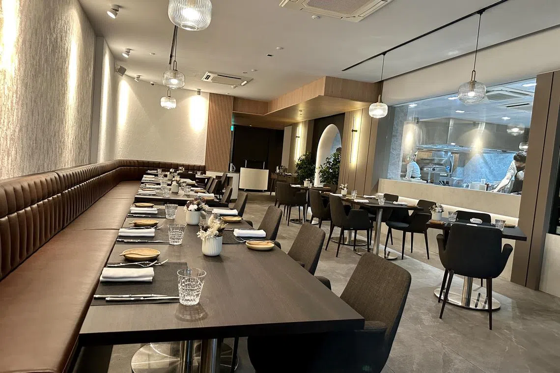 Cuisson's interiors are spacious and plush, with a see-through wine cellar.