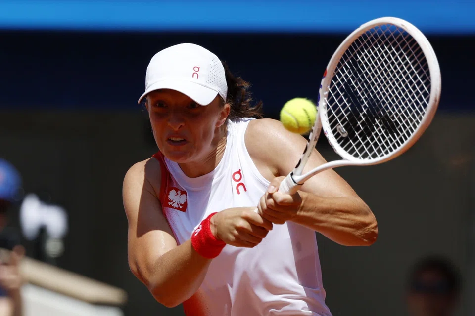  Iga Swiatek of Poland (top) beat Diane Parry aside 6-1, 6-1 and will meet China’s Wang Xiyu for a place in the quarter-finals.