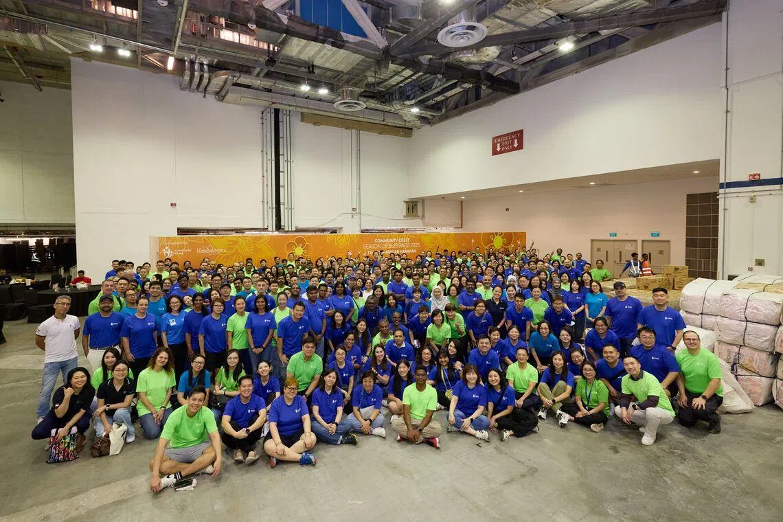 The volunteers gathered for Community Chest Season of Blessings 2026 at Sands Expo and Convention Centre to pack and deliver the festive bags. 
