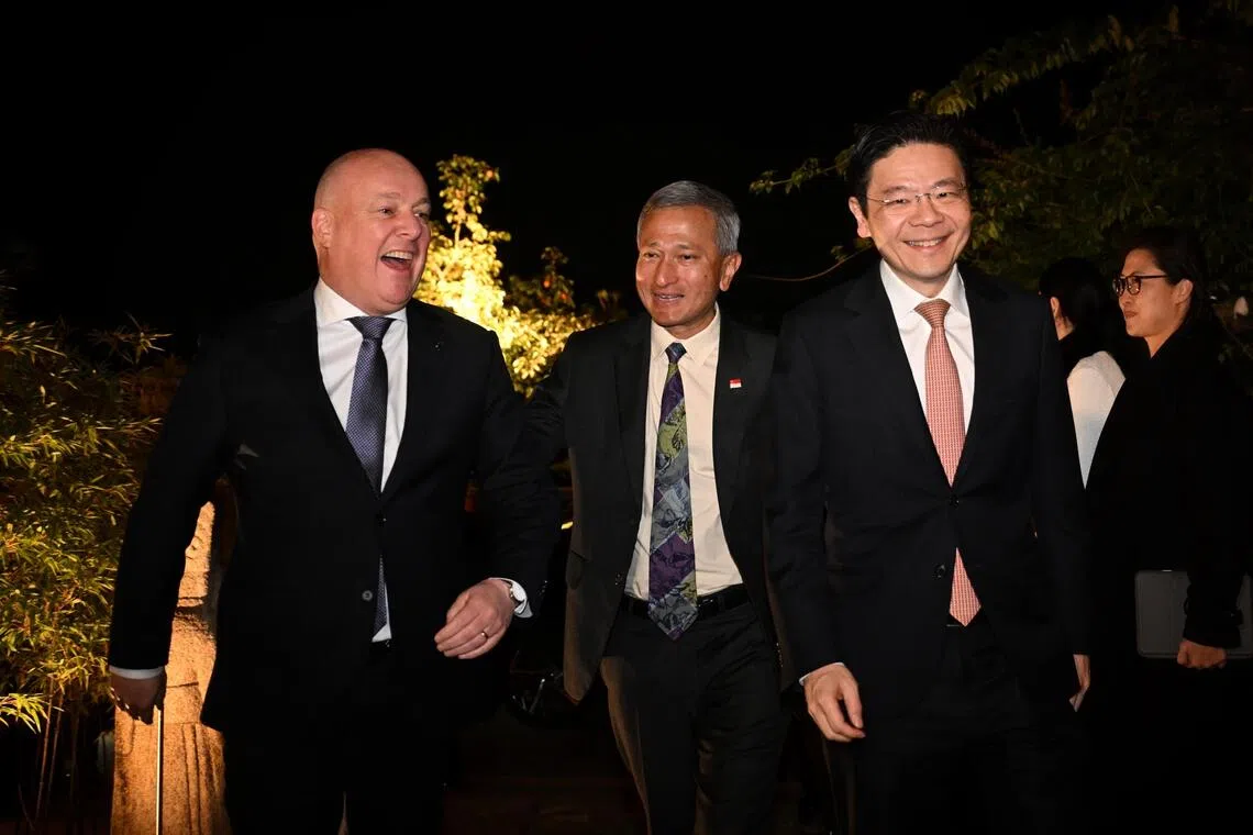 From left: New Zealand Prime Minister Christopher Luxon welcoming Singapore's Foreign Minister Vivian Balakrishnan and PM Lawrence Wong to dinner on the sidelines of Apec meetings in Gyeongju, South Korea.