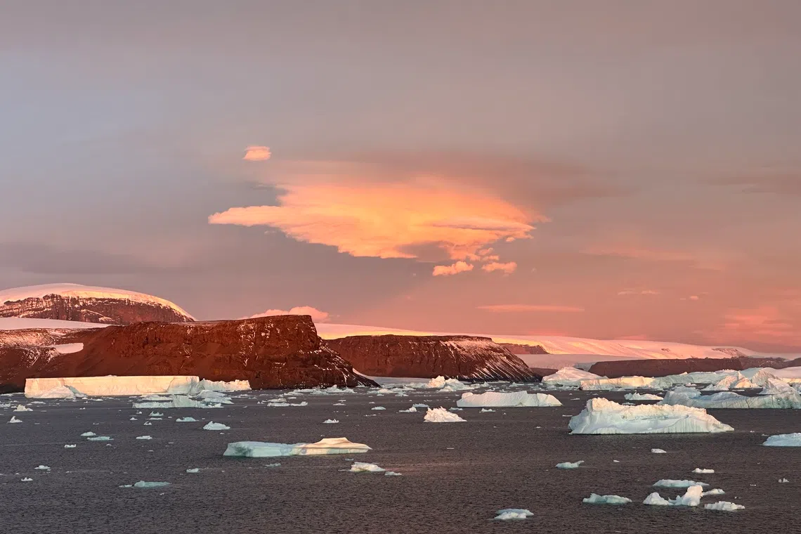 Majestic sunsets add allure to wintry seascapes of the Antarctic.