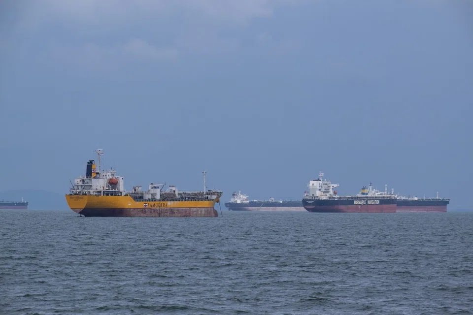 The bunching up of vessels outside Singapore's container port is pushing freight rates ever higher, with no immediate end to the congestion in sight. 