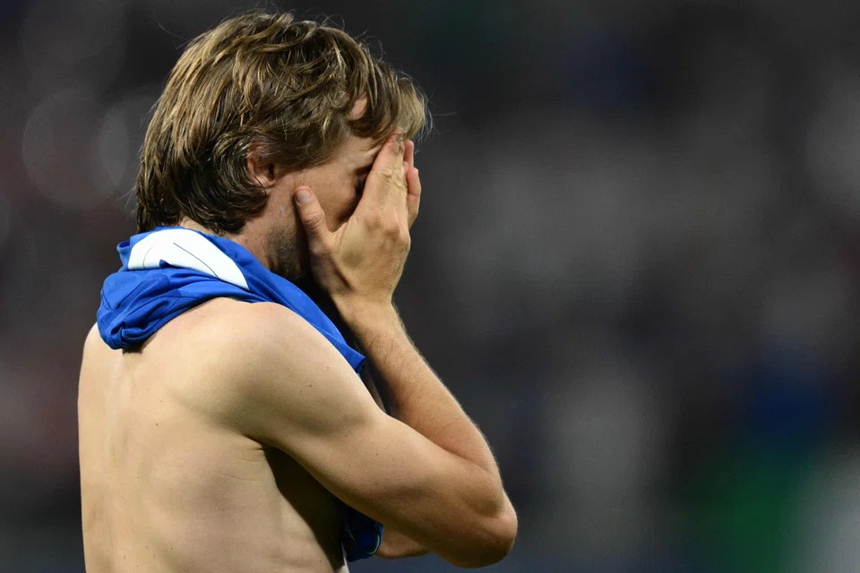 Croatia's midfielder Luka Modric reacts to their probable Euro 2024 exit after the match between Croatia and Italy in Leipzig, Germany, June 24, 2024. 