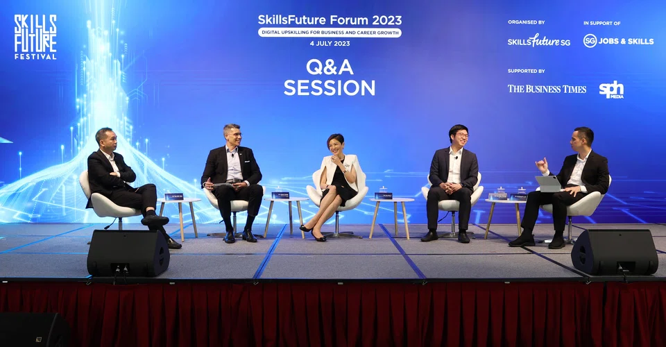 From left: Panellists Tan Kok Yam, chief executive of SkillsFuture Singapore; Aslam Sardar, CEO of the Institute for Human Resource Professionals; Lee Hui Li, managing director of Microsoft Singapore; Lee Kian Chong, CEO of Deli in the Park; and moderator Christopher Lim, associate editor for product at The Business Times.