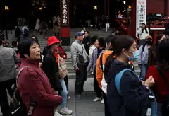 Chinese tourists at the Sensoji temple in Tokyo. Arrivals from China to Japan have been depressed in the wake of a recent diplomatic spat.