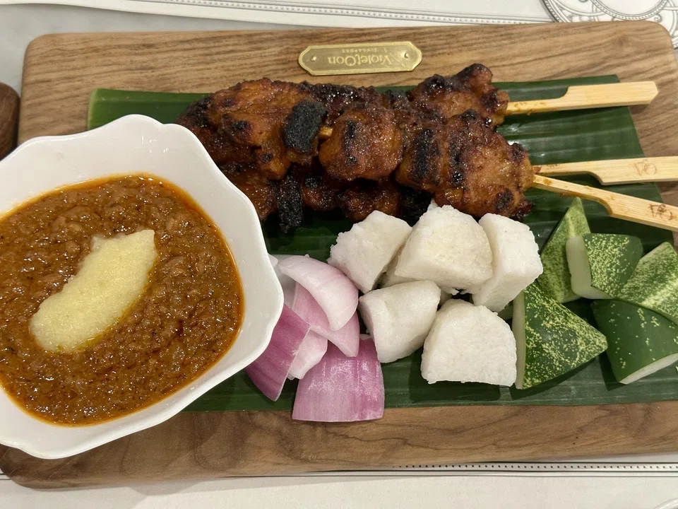 Pork satay with peanut and pineapple sauce.